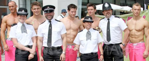 Gay police with topless men at Gay Pride 40th Anniversary Parade in London. Pic: Demotix